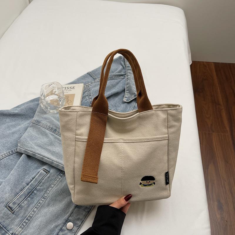 Lightweight canvas bag women's 2025 new autumn and winter leisure college students class portable commuter bag portable bucket bag