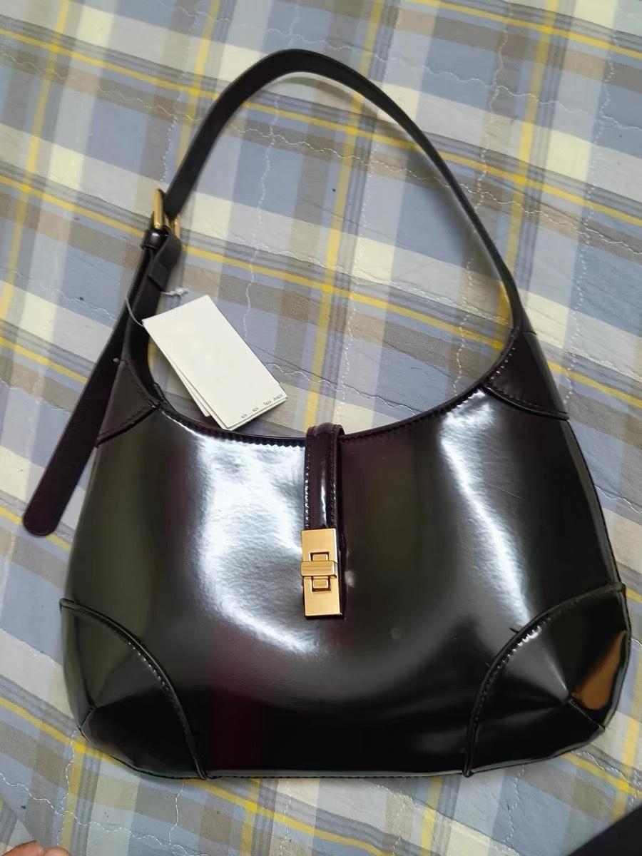 

2024 осень и зима новая нишевая дизайнерская модная сумка-полумесяц для поездок на работу, универсальная сумка подмышку, высококлассная повседневная сумочка чёрный