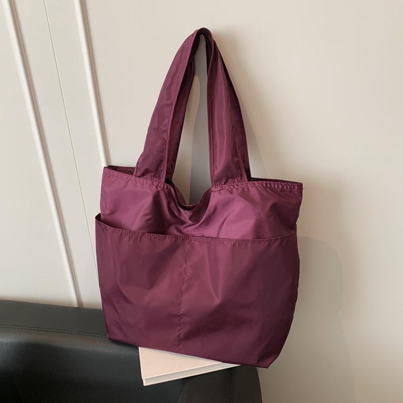 European-American Fashion Large Capacity Travel Bag - Solid Color, Nylon, Handheld or Shoulder Style for Women