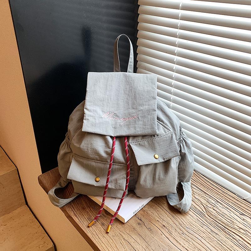 New Korean version of student schoolbag women's high-value commuter travel bag solid color large-capacity casual backpack women
