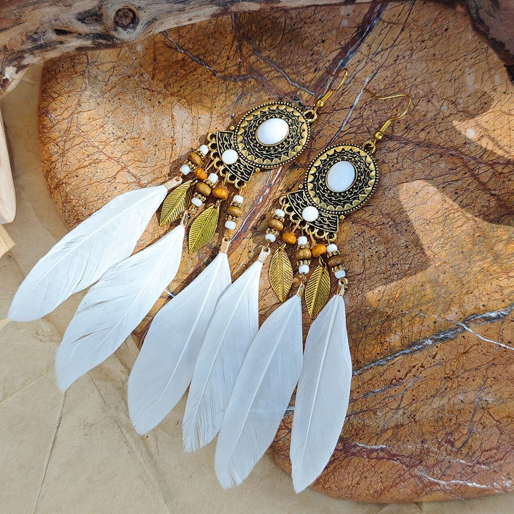 Retro ethnic style woven feathers long fringed earrings, bohemian high-end hollow rice bead earrings