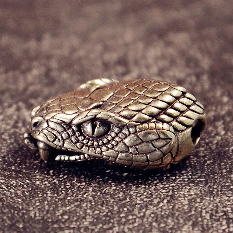 

Підвіска EDC Голова Змії - Брелок з суцільної латуні/нейзильберу та аксесуар з паракорду для кріплення спорядження (Нове прибуття) срібний