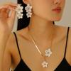 Elegant Alloy Flower Pendant Necklace and Earrings Set for Women - Fashionable, High-End, and Versatile.