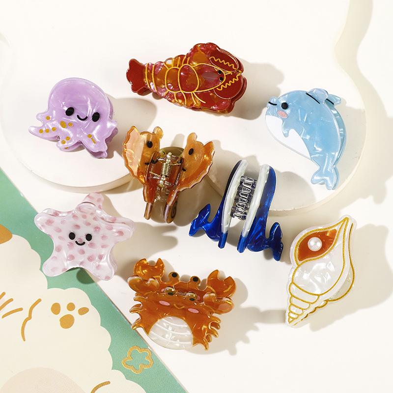 Niedliche Ozeantier Acetat Krallenklemme: Muschel, Delfin, Seestern, Welpen-Design