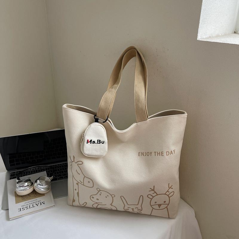 2025 autumn new leisure commuter large-capacity canvas bag women's niche shoulder bag graffiti portable tote bag