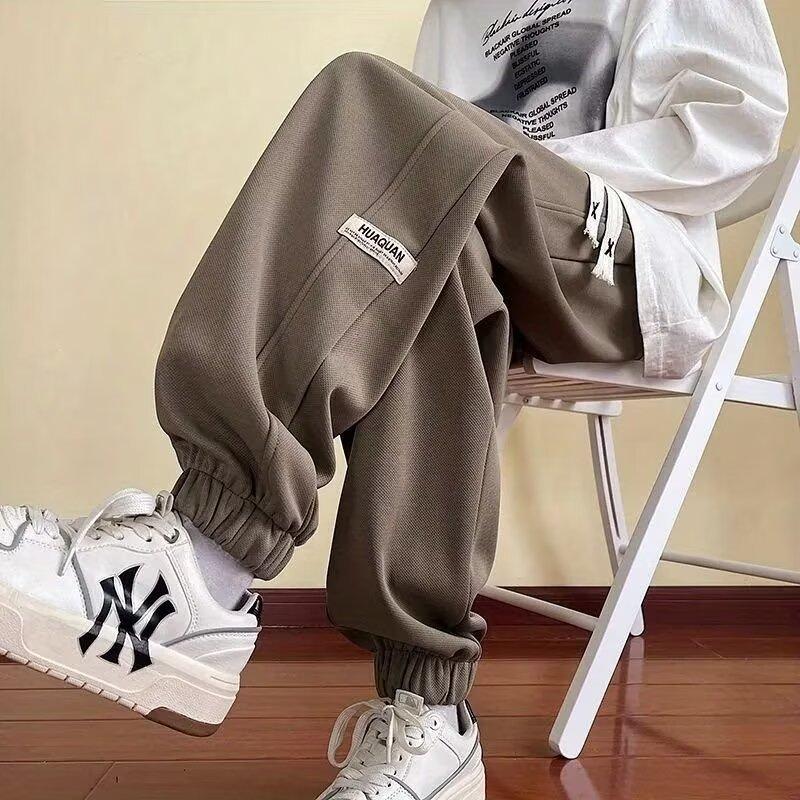 Jarní a letní volné kalhoty pro pánský šatník Design kalhot Trendy Sportovní Všestranné a pohledné Ležérní kalhoty