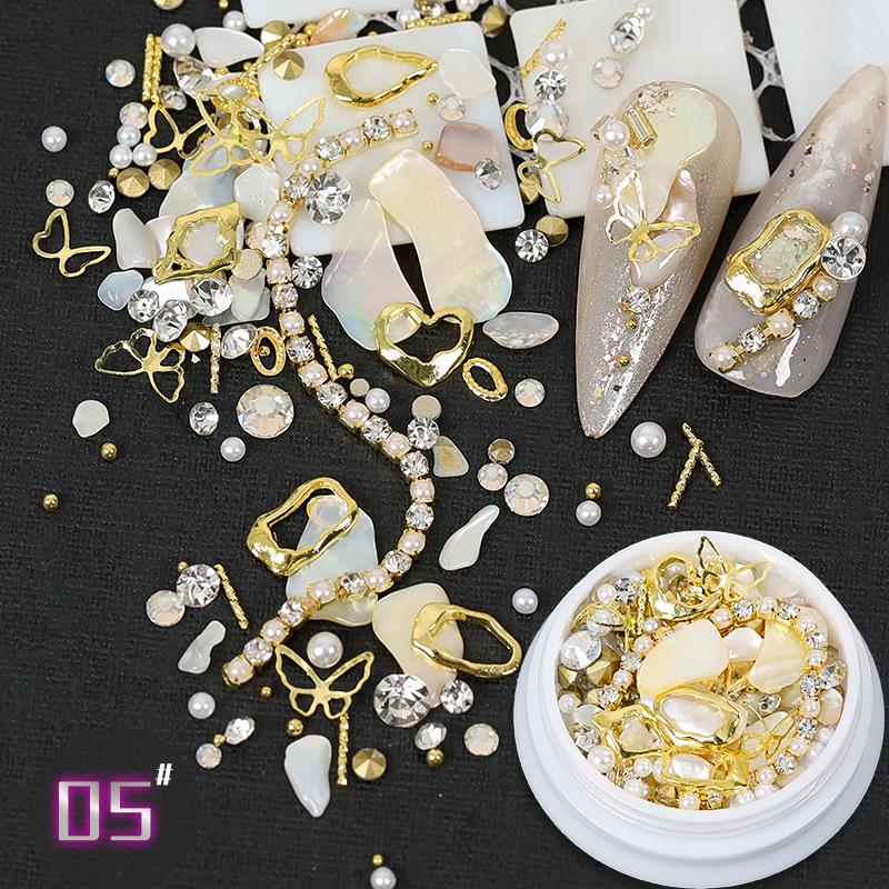 Dolphin Bay Nail Art: Shell Pieces, Rhinestones, Pearls, and Metal Chains Mixed Decorations