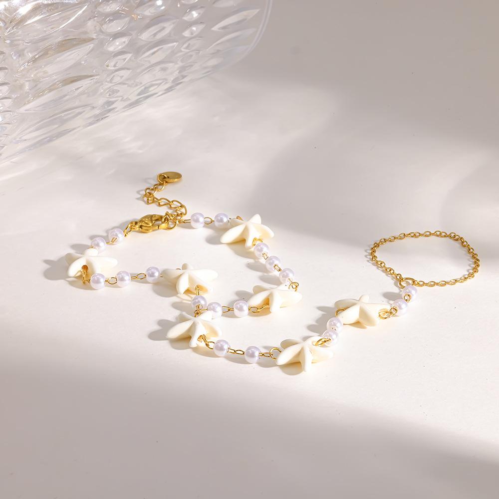 European and American stainless steel back chain starfish vacation wind plated 18K gold imitation pearl jewelry waterproof finger bracelet