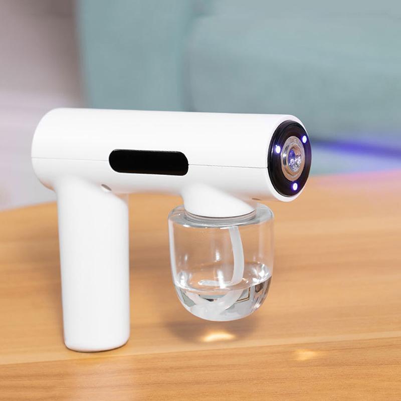 Tragbare Hand-Elektro-Befeuchtungssprühpistole Haushalts-Reisebedarf Zerstäubtes Blaues Licht Wiederaufladbare Desinfektionspistole