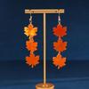 Elegant Maple Leaf Tassel Earrings - Red Acrylic Dangles for a Face-Slimming Effect