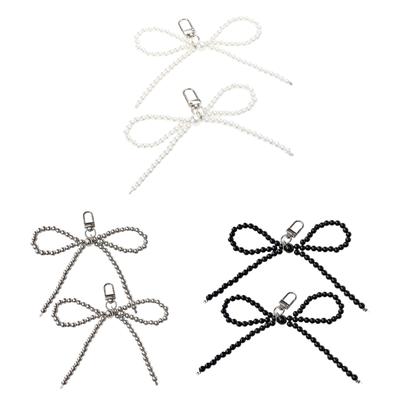 2pcs Breloque de téléphone 3D Noeud papillon perle Pendentif Porte-clés pour Sac à main Sac à dos Accessoires Femme Fille Lanière Pendentif