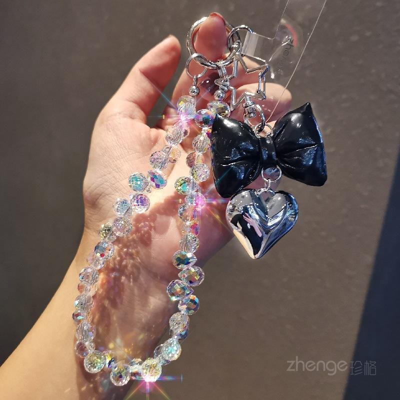 Small fragrance bow tie, love mobile phone hanging chain, ins mobile phone case, pendant, beaded chain, short fashion women's wrist ornament