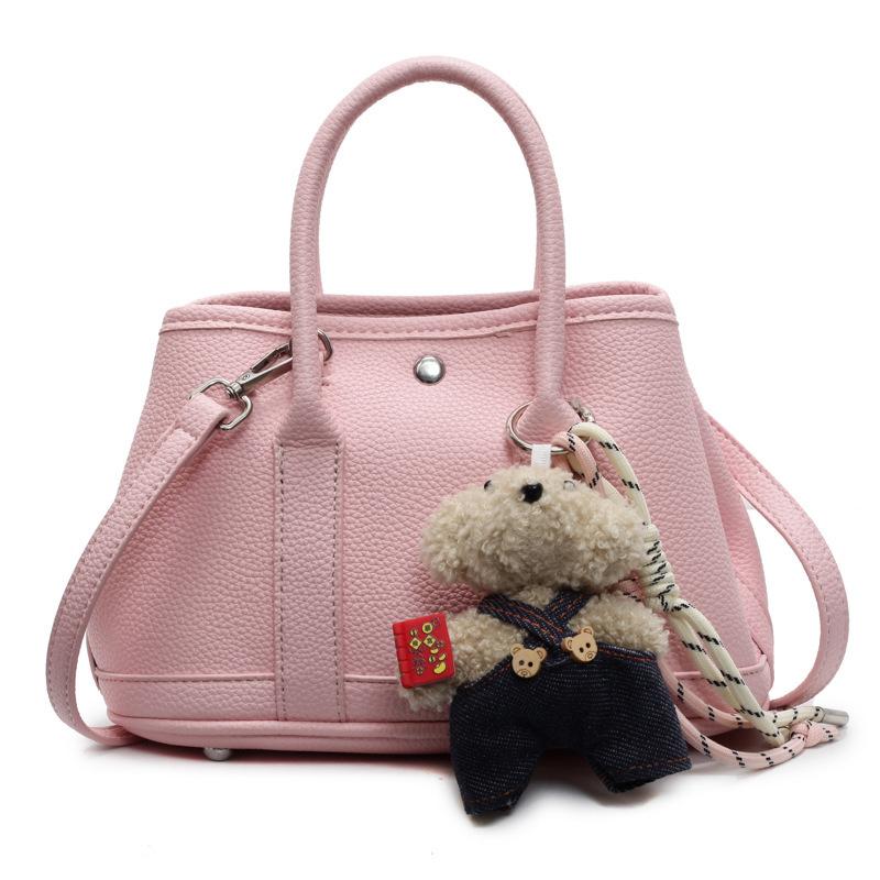 2025 New Niche Simple Leisure Commuter Portable Bucket Bag Versatile Solid Color Child and Mother Bag Messenger Bag Bag