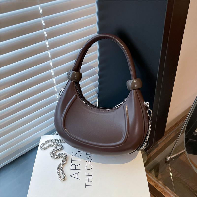 

Нишевый дизайн универсальная сумка-мессенджер женская 2025 весна и лето новая трендовая ретро портативная сумка-полумесяц на плечо темно-коричневого