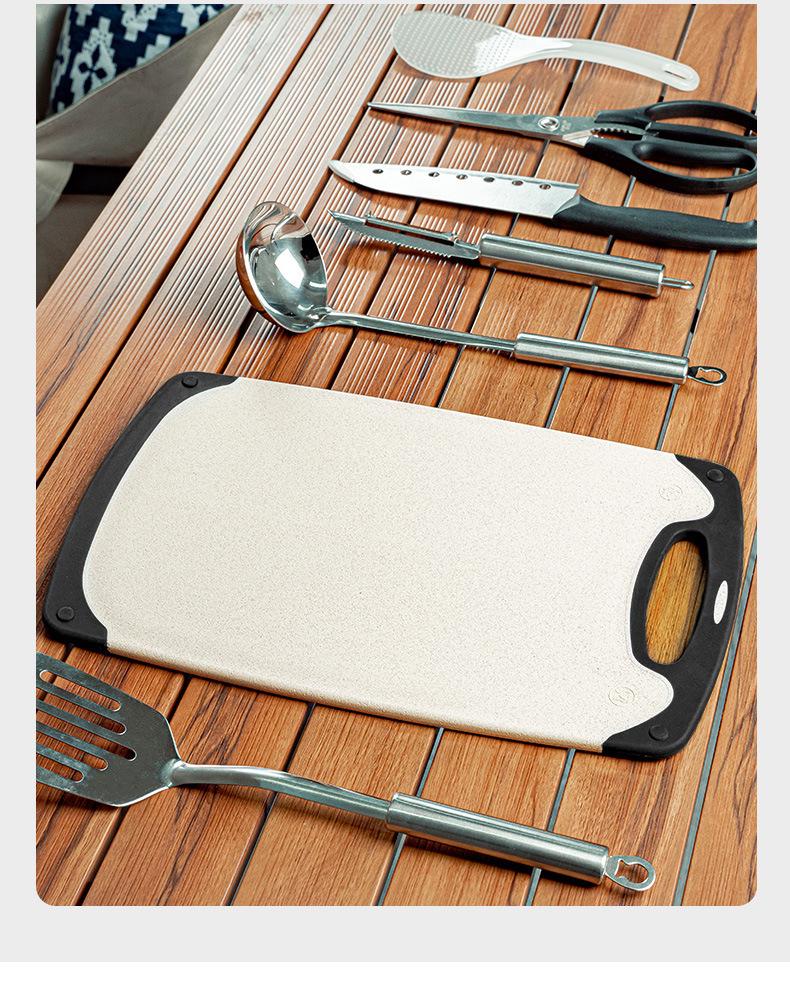 Portable Outdoor Cookware Set: Stainless Steel Cutlery, Storage Bag, and Cutting Board for Camping and Picnics.