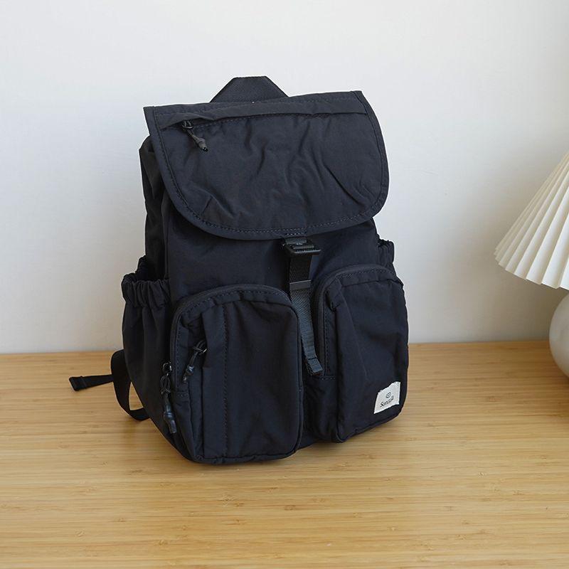 

Lightweight Backpack Minimalist Outdoor Casual Backpack Genuine Goods Waterproof Nylon Travel Mountaineering Bag Computer Bag Small size black small pendant