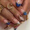 Almond-Shaped Gilded Press-On Nails with Blue Gem Accent