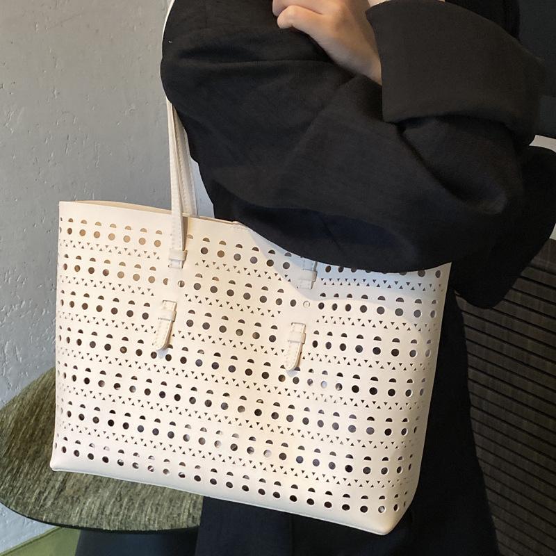 2025 spring and summer new niche high-end hollow tote bag large-capacity temperament commuting single shoulder child and mother bag