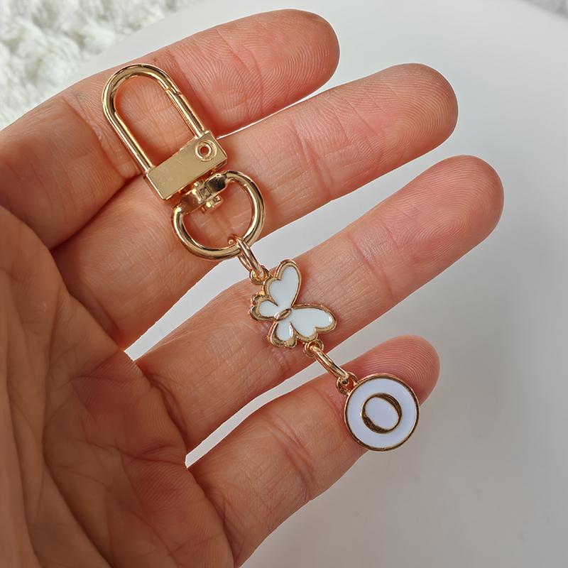 1 Stück Schlüssel-Logo Leichter Schlüsselanhänger Autoschlüssel Begleiter Taschenanhänger Langlebigkeit Metallschlüsselanhänger Monogramm-Anhänger Schmetterling Monogramm-Schlüsselanhänger