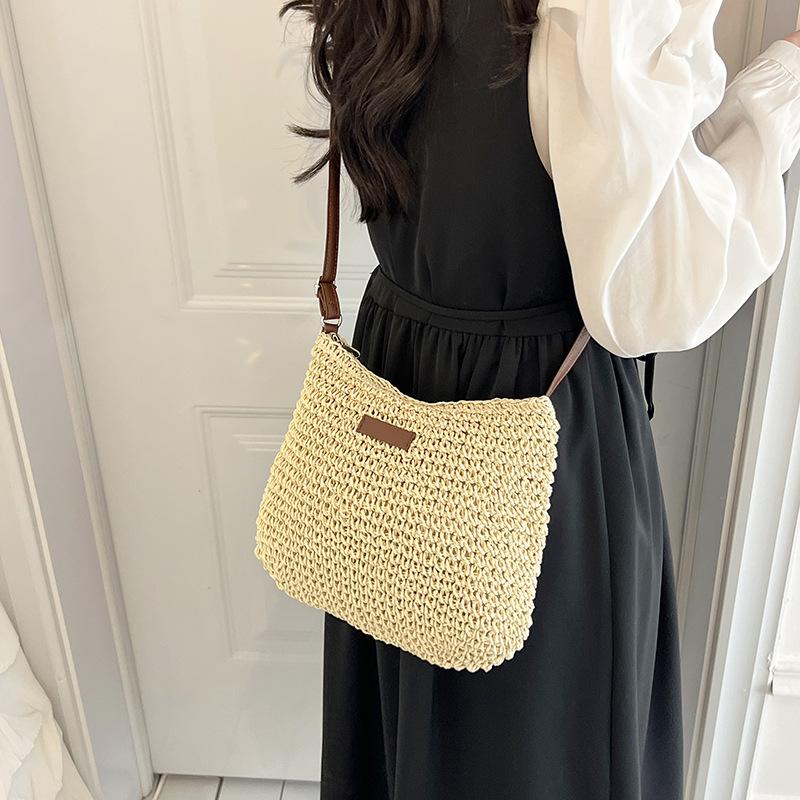 Nischen-Webstrohtasche Damen Frühling und Sommer 2025 neu vielseitige Schulter-Umhängetasche Strandurlaub Strandtasche