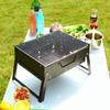 Grote opvouwbare draagbare zwarte BBQ-barbecuegrill buiten houtskoolreispicknick
