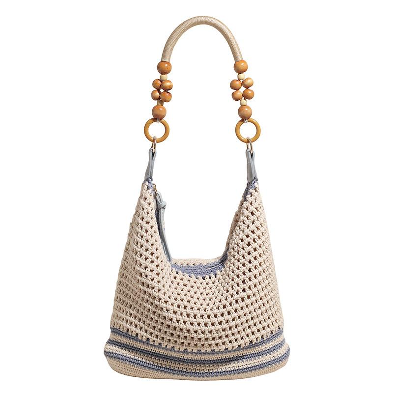 Holiday style woven bag women's 2025 new knitted hollow shoulder bag fashionable large-capacity messenger bag beach bag