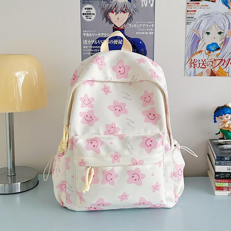 Nowy tornister jest wysokiej jakości, świeży, słodki i uroczy, a plecak w gwiazdki to lekki plecak podróżny dla uczniów gimnazjum.