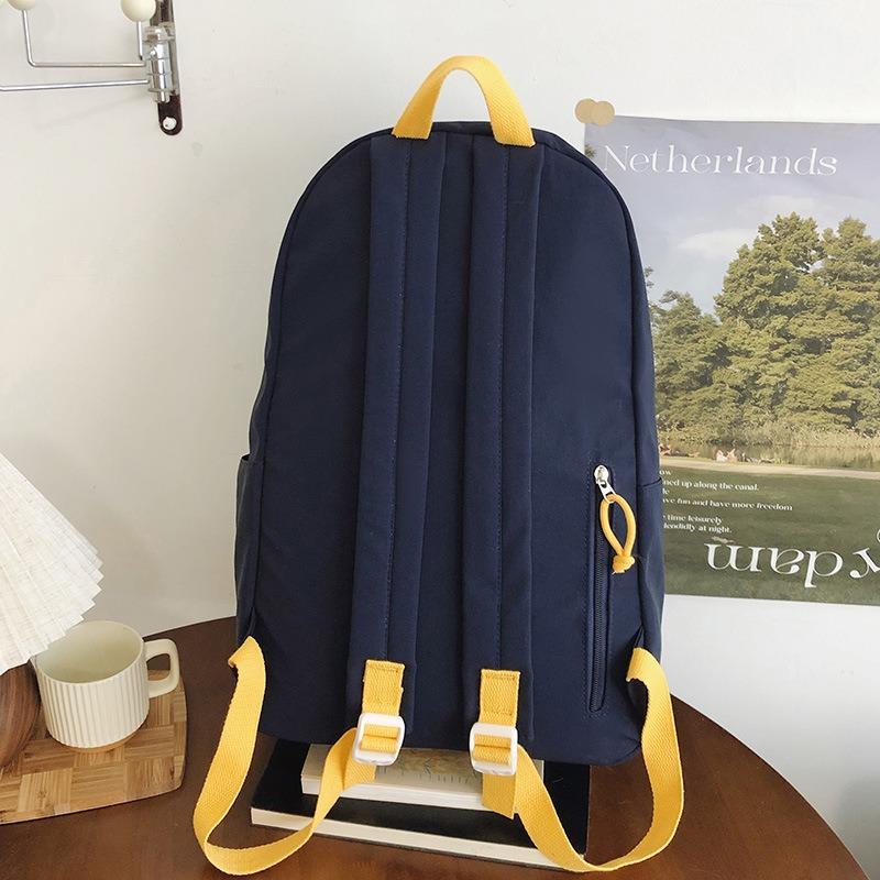 New High-value Solid Color Simple Letter Backpack Couple Casual Lightweight Large-capacity Backpack