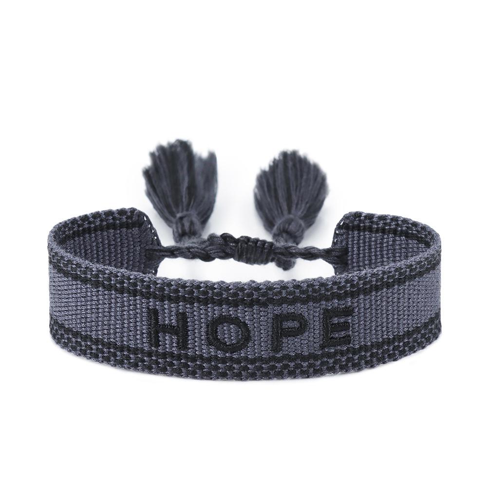 Europäisches & Amerikanisches Besticktes Freundschaftsarmband: Handgefertigter gewebter Quaste mit Logo-Schriftzug.