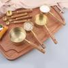 A Set of Eight Stainless Steel Measuring Cups and Wooden Handled Spoons for Kitchen Baking Tools, Measuring Tools, and Scales