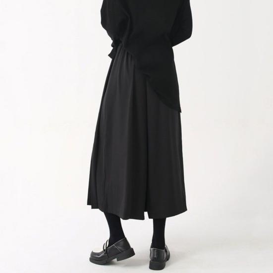Pantaloni da donna stile scuro nero tinta unita plissettati finti due pezzi irregolari high street larghi gamba larga casual individuali lunghezza a metà polpaccio pantaloni culottes