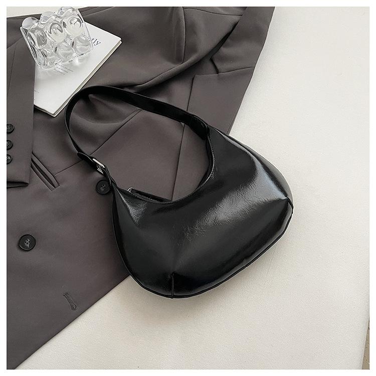 

Small bag trend 2025 new fashion handbag high sense versatile women s bag single shoulder solid color half moon armpit bag