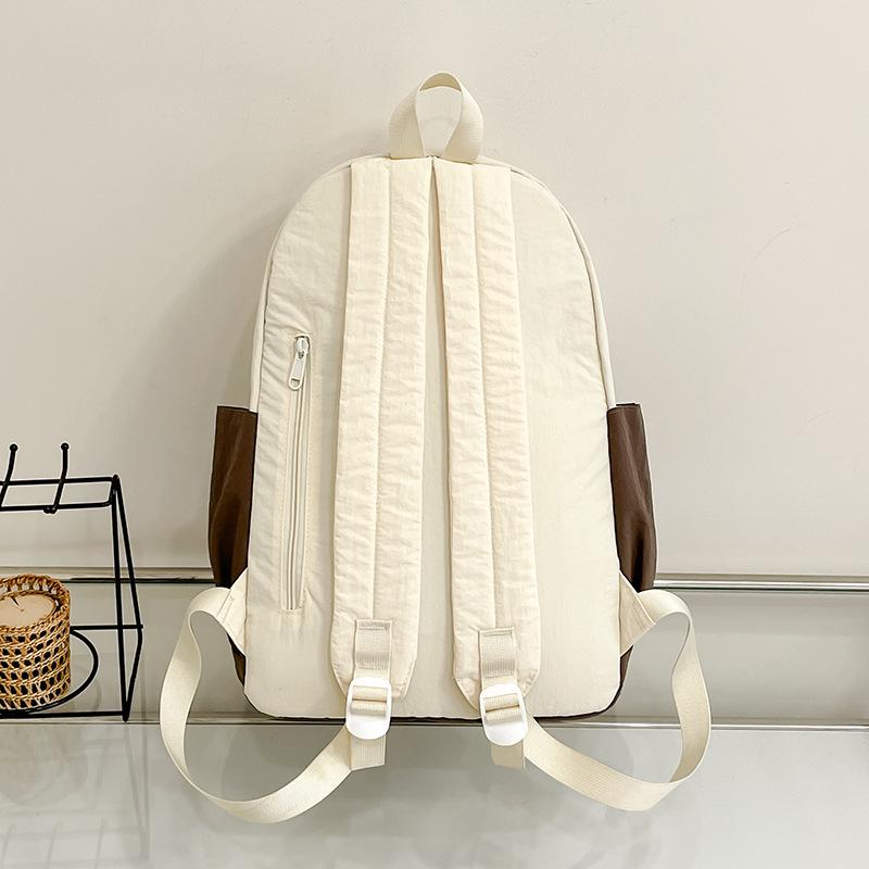 Simple schoolbag, Korean contrasting colors, new schoolbag, light travel and leisure backpack, high value, dirt-resistant