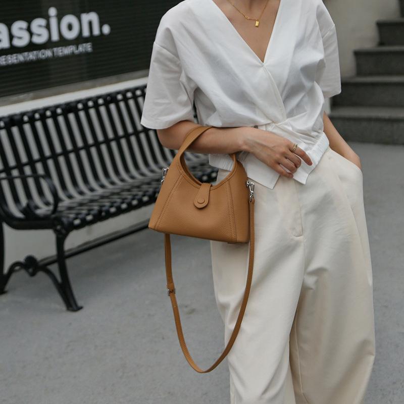 Leather women's bag semi-round moon bag niche design 2025 new cowhide shoulder crossbody armpit bag portable