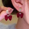 French Retro Red Flocking Bow Earrings for Women - Festive, Versatile Studs for New Year.