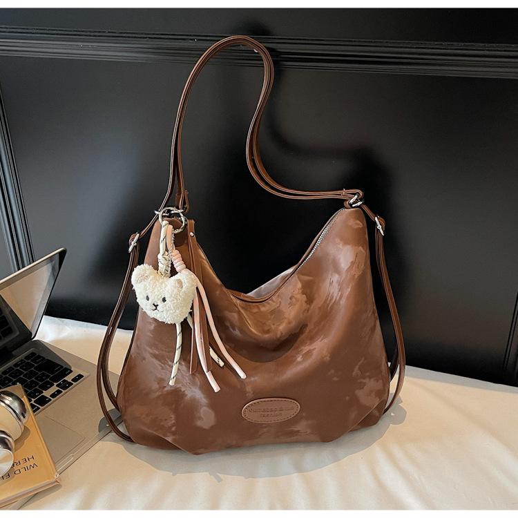 

2025 новая расслабленная мода универсальная сумка-тоут нишевая высококлассная текстура многоцелевой рюкзак ретро сумка через плечо темно-коричневого