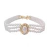 Women's Multi-Layer Pearl & Diamond Oval Necklace: Retro Hepburn Style, Light Luxury, Perfect for Sweaters and Dressy Outfits.