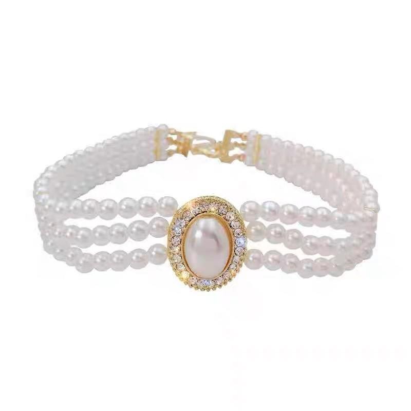 Women's Multi-Layer Pearl & Diamond Oval Necklace: Retro Hepburn Style, Light Luxury, Perfect for Sweaters and Dressy Outfits.