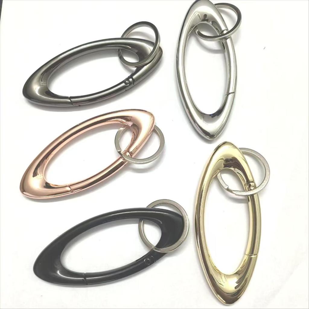 Oval Keychain Bag Pendant with Zinc Alloy Carabiner and Metal Spring Ring Accessory