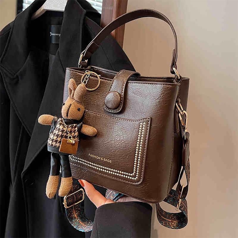 

Сумка-ведро 2025 новая летняя кожаная женская сумка ретро широкий плечевой ремень модная сумка через плечо сумка-мессенджер багаж