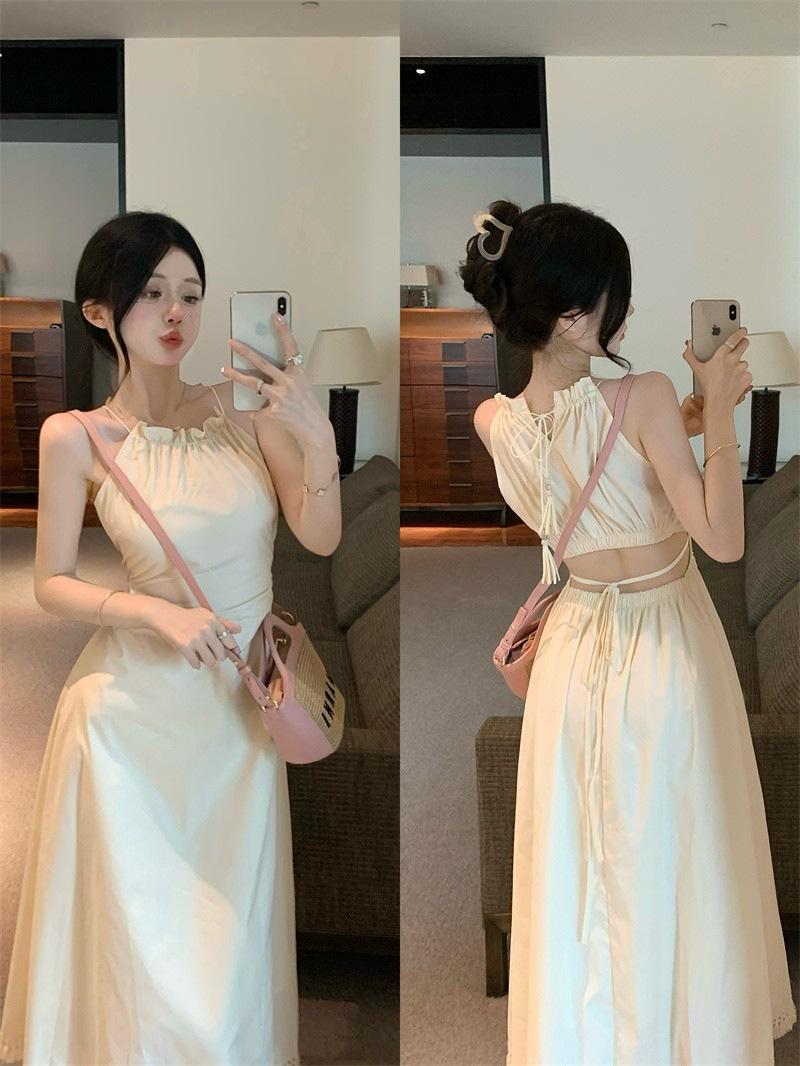 

Hollow back fringed suspender neck dress women s summer design sense waist strap skirt a word medium and long dress S абрикосовый