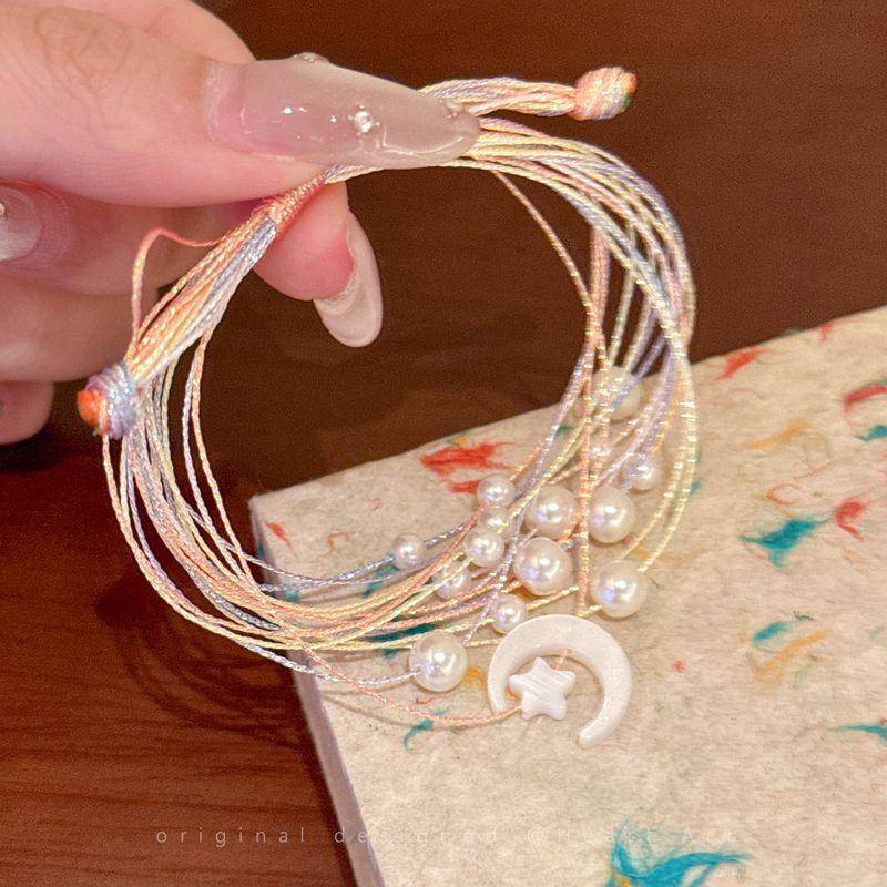 

Браслет из плетеного шнура ручной работы Звезда Луна Разноцветный веревочный браслет Женский Этнический стиль Необычный Регулируемый ремешок Аксессуары нишевые Star Moon Colorful Rope Bracelet