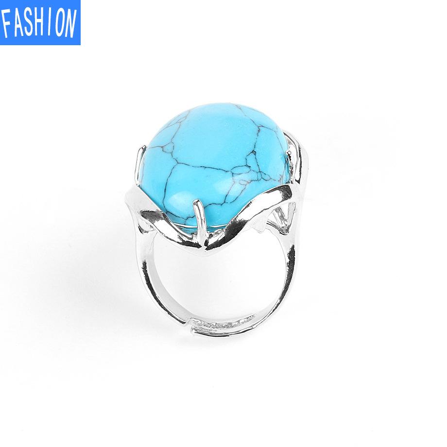 

Кольцо с натуральным овальным кристаллом с четырьмя когтями Blue--Turquoise