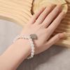 Korean version of simple fashion temperament elegant imitation pearl silver love heart pendant necklace bracelet set versatile