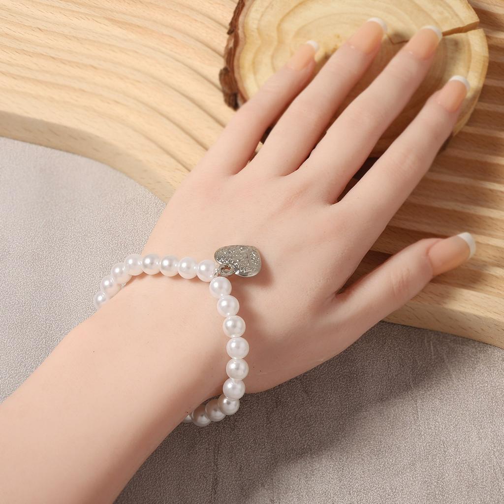 Korean version of simple fashion temperament elegant imitation pearl silver love heart pendant necklace bracelet set versatile