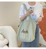 Einfarbige Damen Strand-Schultertasche mit Buchstaben-Design, Damen-Tote aus Canvas, Große Kapazität, Kordelzug, Damen-Einkaufstasche