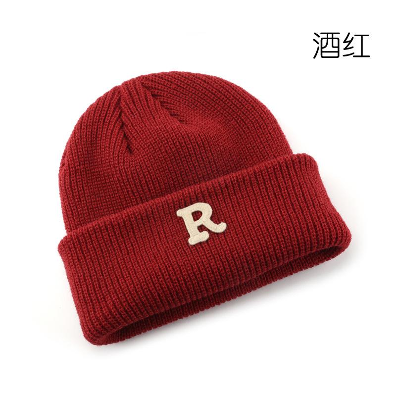 Women's Solid Color Letter Print R Rolled brim knitted hat for outdoor cycling, providing warmth, cold protection, and ear coverage