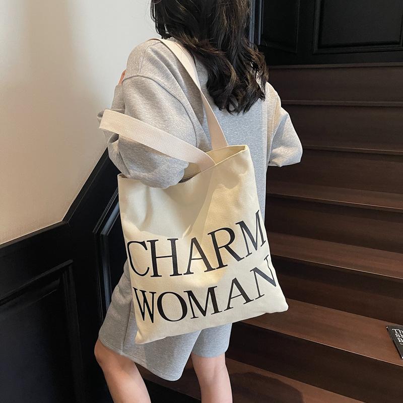 Large capacity alphabet canvas bag women's new fashion portable commuter bag versatile shoulder tote bag