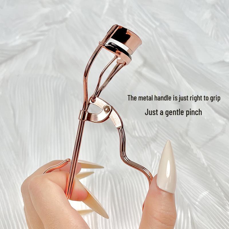 

Dream Kiss Compact Eyelash Curler: Portable Makeup Tool for Beginners.