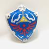 Morbido e Comodo Cuscino Peluche Cartone Animato di Zelda con Design dello Scudo Hylian